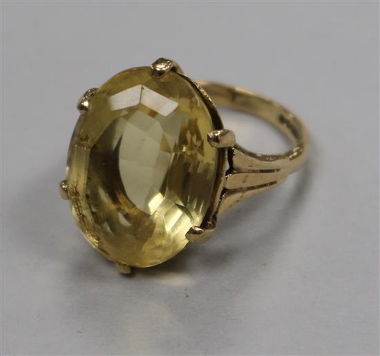 A 9ct gold and oval citrine dress ring, size L.